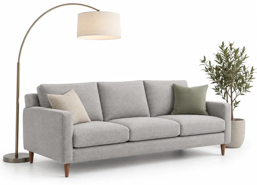Grey fabric sofa with arc floor lamp and potted plant